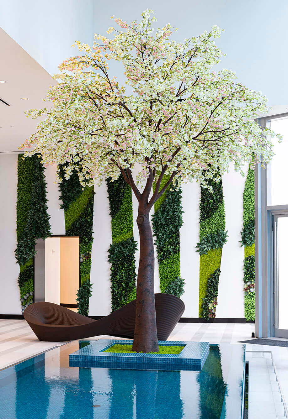Artificial cherry blossom tree in front of Vertical Garden