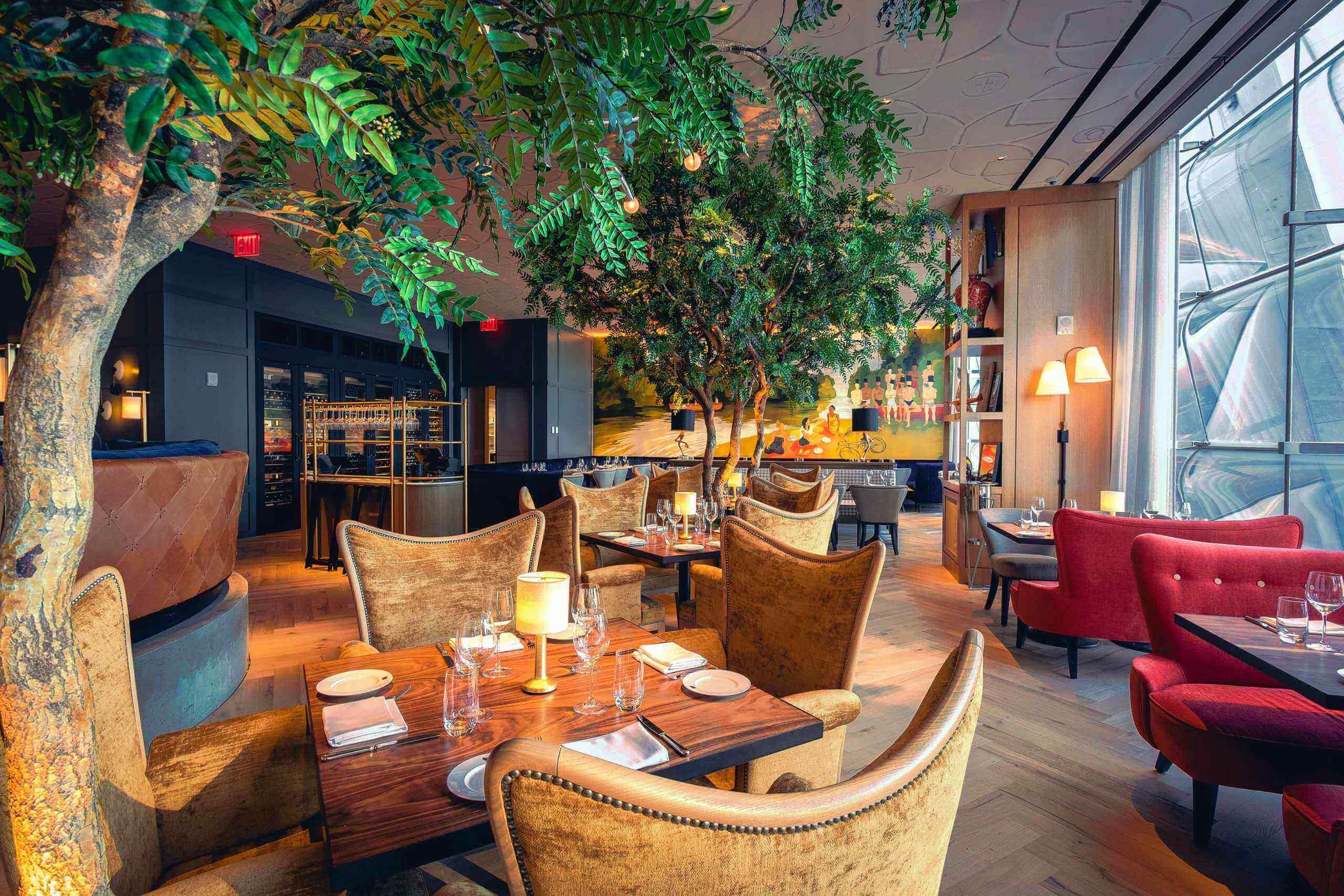Lower angle view of Artificial indoor Acacia trees in Queensyard Restaurant in New York