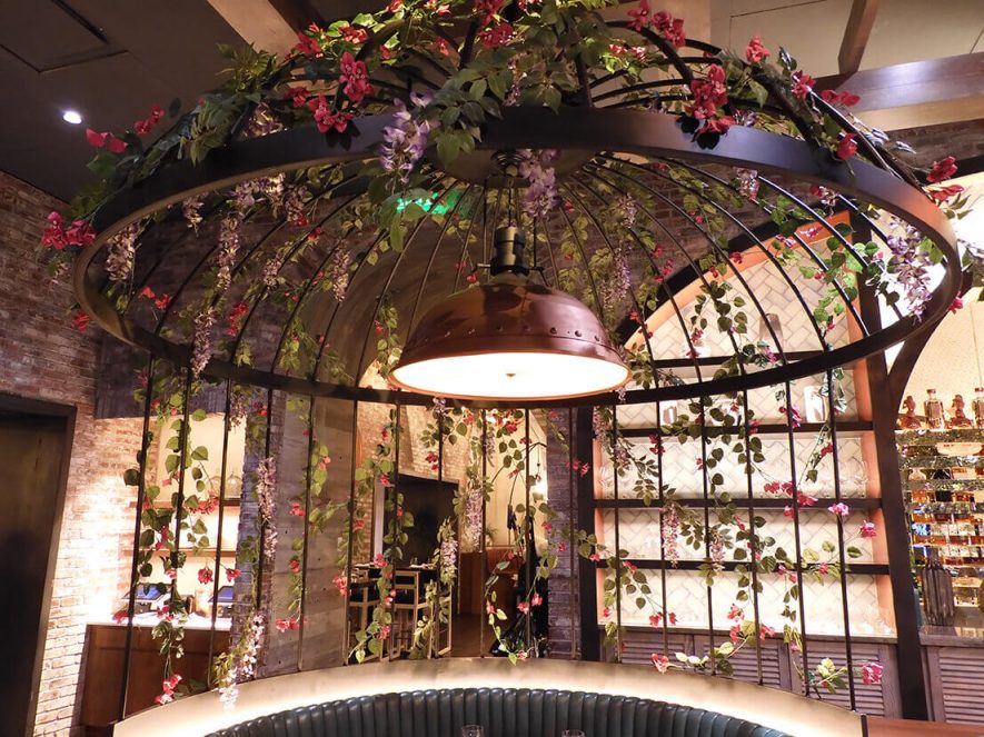 Birdcage booth adorned by Artificial Bougainvillea Plant at the Catch Restaurant in Aria Las Vegas