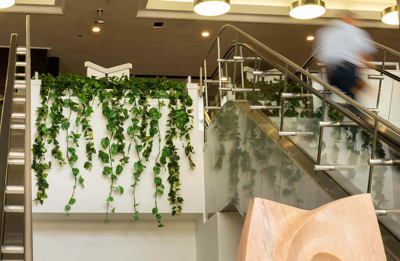 Replica ivy between the upper escalator landings at Datran Business Center