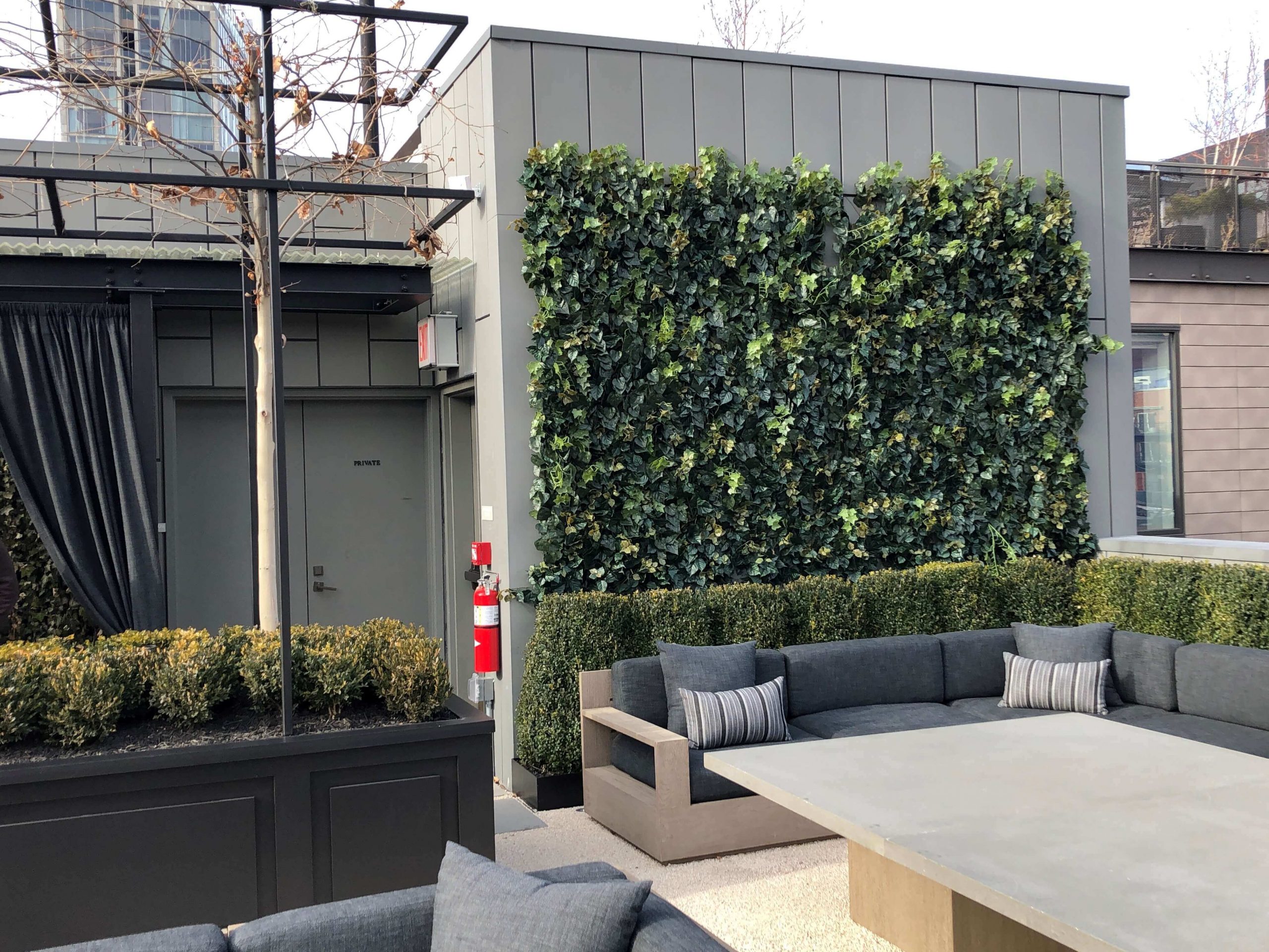 Fabricated Exterior Green Wall & Preserved Boxwood Hedges at RH New York Restaurant