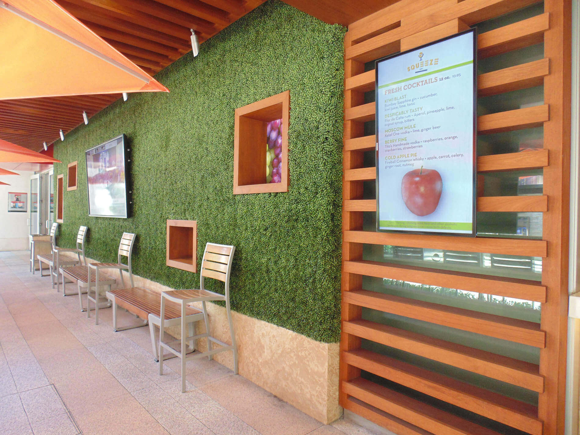 Artificial green walls at squeeze juice bar