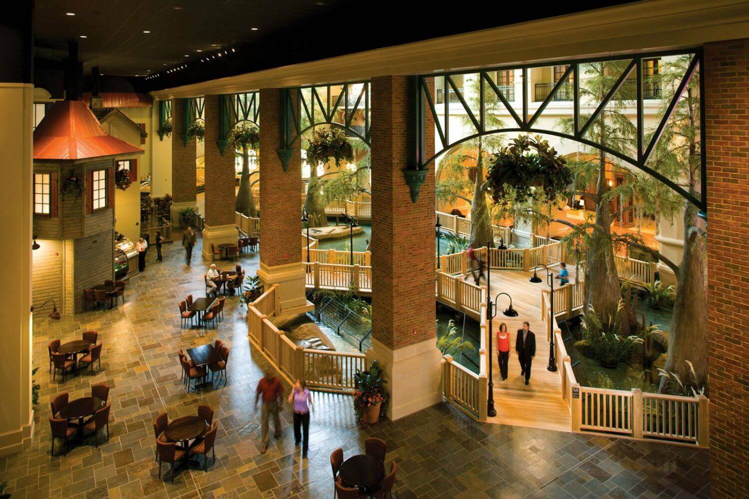 Overhead view of atrium with live alligators and artificial trees at Paragon Hotel & Casino