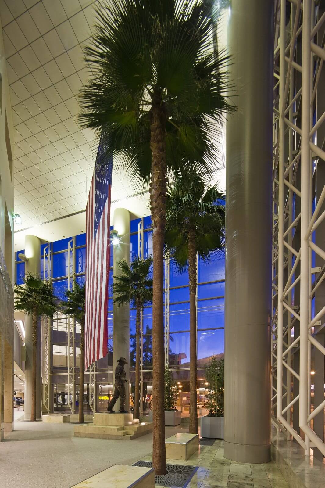 Preserved Washingtonia Robusta Palm Trees and Trimmed Fabricated Golden Bamboo Plants at John Wayne Airport