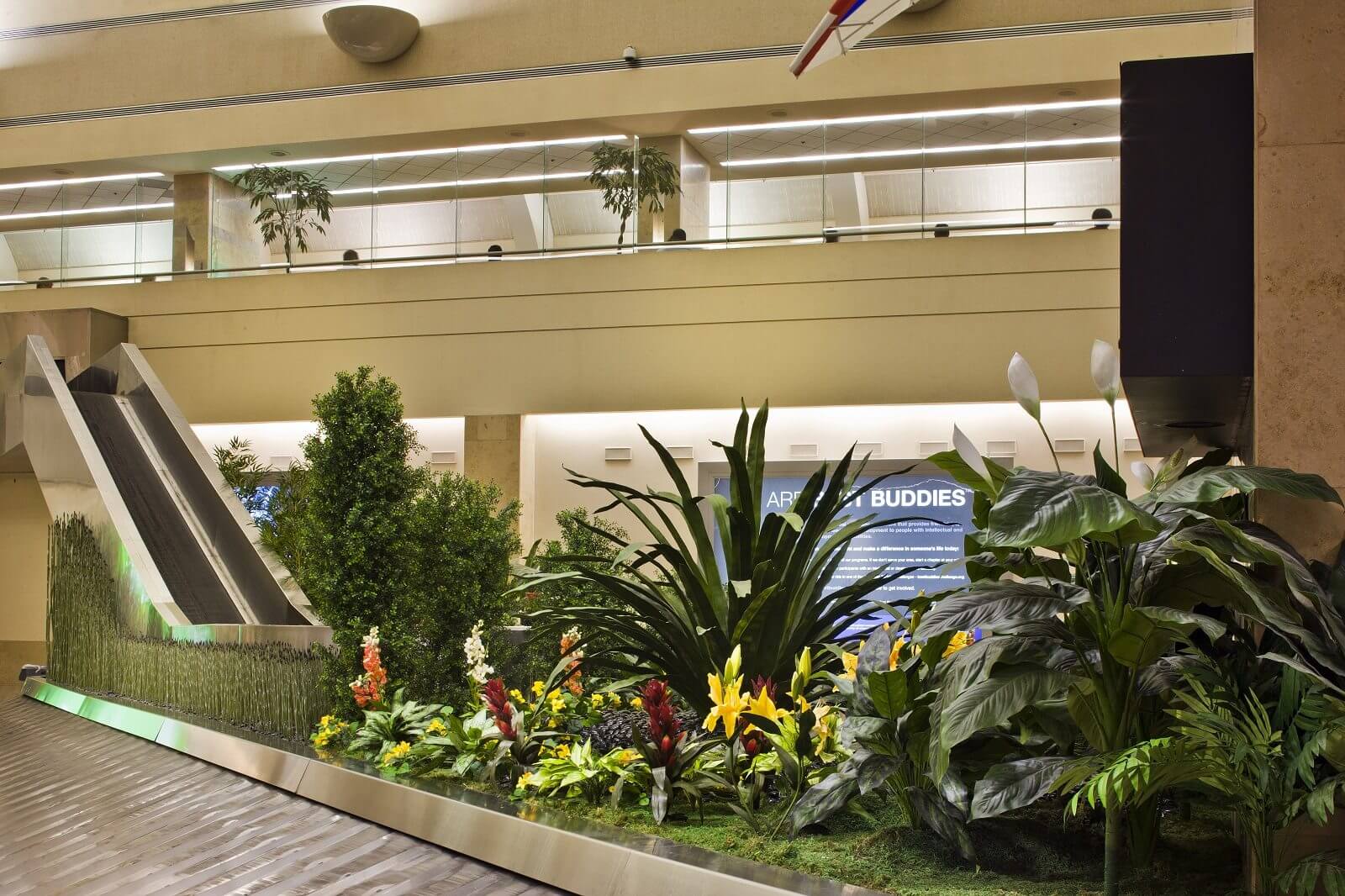 Replica Plants and Trees decorate baggage carousel at John Wayne Airport