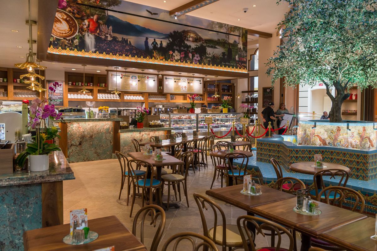Service counters and seating areas surround Fabricated Mediterranean Olive Tree at Las Vegas Cafe