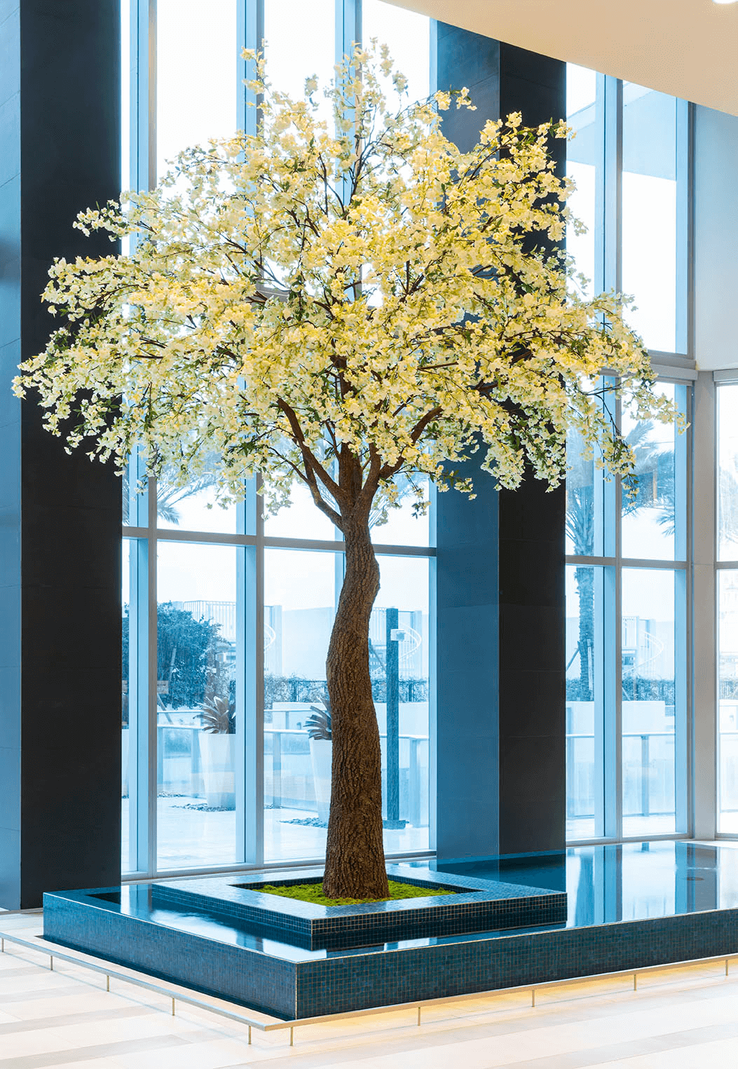 Artificial Cherry Blossom Tree at Paramount Miami with window in background